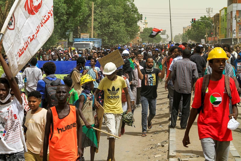 People march against military rule in the Bashdar area of Sudan's capital Khartoum. AFP