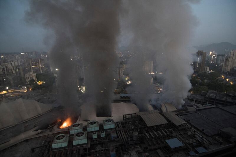 Smoke billows after a fire broke out at the Sunrise Hospital in Mumbai, India. Reuters