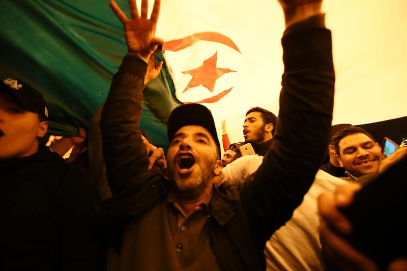 People celebrate in Algiers. AP Photo