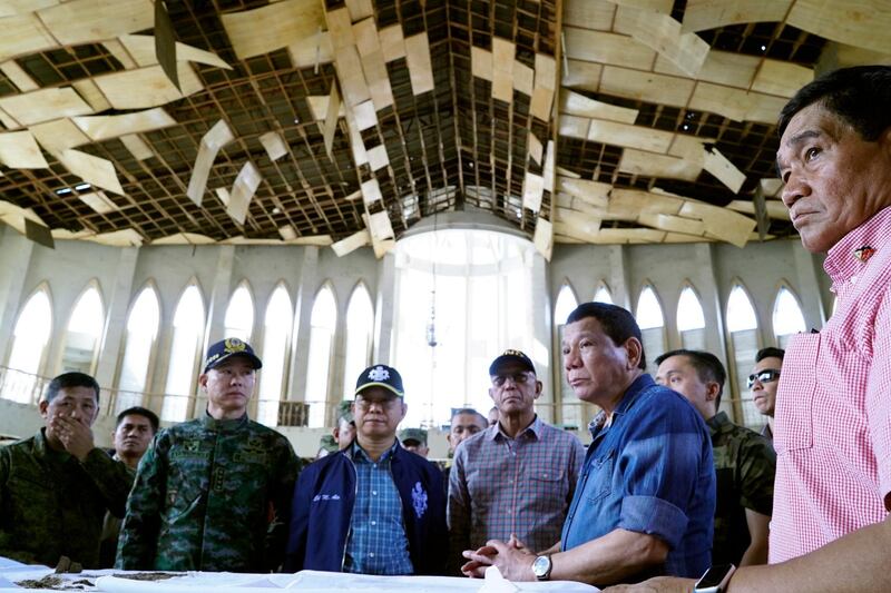Rodrigo Duterte inspects a Catholic church damaged by explosion in Jolo, Sulu province, southern Philippines, 28 January 2019. EPA