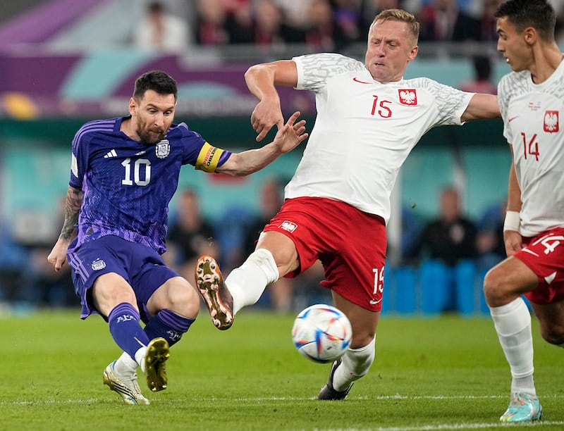 Poland's Kamil Glik tries to block a shot by Argentina's Lionel Messi during the Qatar 2020 World Cup final Group C match at Stadium 974. AP 