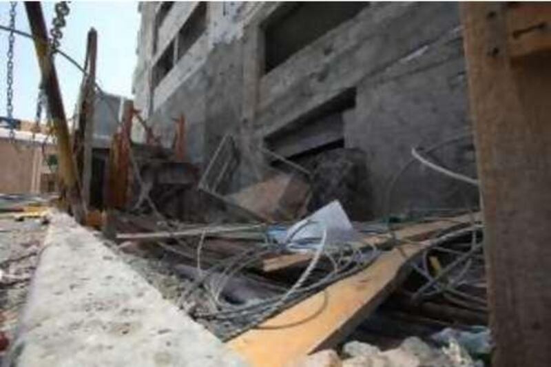 AL SHARJAH - JULY 4,2010 - Debris of collapsed scaffolding that resulted to the death of three workers last friday afternoon in Al Nahda , Sharjah . ( Paulo Vecina/The National ) 