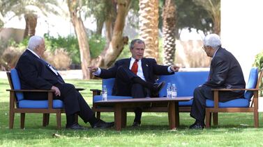 US President George W Bush, centre, discusses the Middle East peace process with Israeli Prime Minister Ariel Sharon, left, and Palestinian Prime Minister Mahmoud Abbas in Aqaba, Jordan in 2003. Reuters