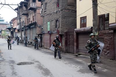 Indian paramilitary soldiers patrol a deserted street during the second phase of India's general elections, in Srinagar, Indian controlled Kashmir, Thursday, April 18, 2019. Kashmiri separatist leaders who challenge India's sovereignty over the disputed region have called for a boycott of the vote. Most polling stations in Srinagar and Budgam areas of Kashmir looked deserted in the morning with more armed police, paramilitary soldiers and election staff present than voters. (AP Photo/ Dar Yasin)