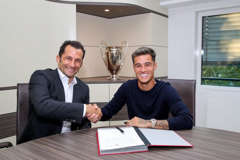 Brazilian midfielder Philippe Coutinho, right, poses with Bayern Munich's sporting director Hasan Salihamidzic after completing a season-long loan move from Barcelona. AFP