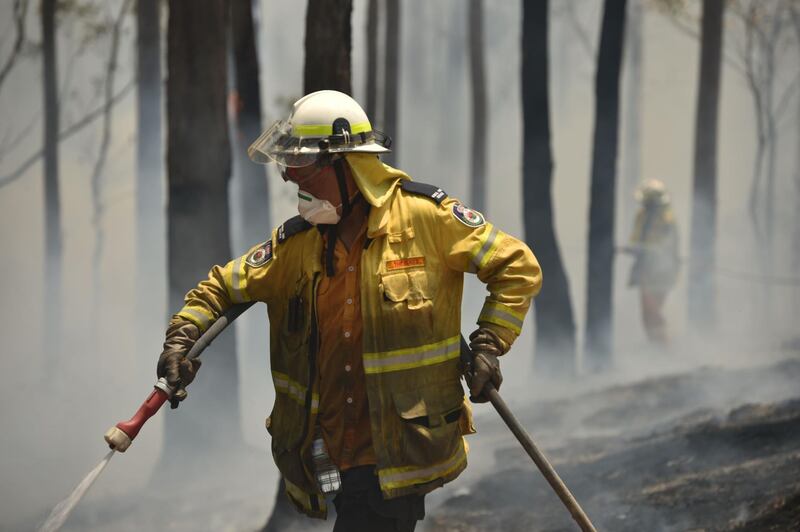 Firefighters tackle a bushfire near Batemans Bay in New South Wales. AFP