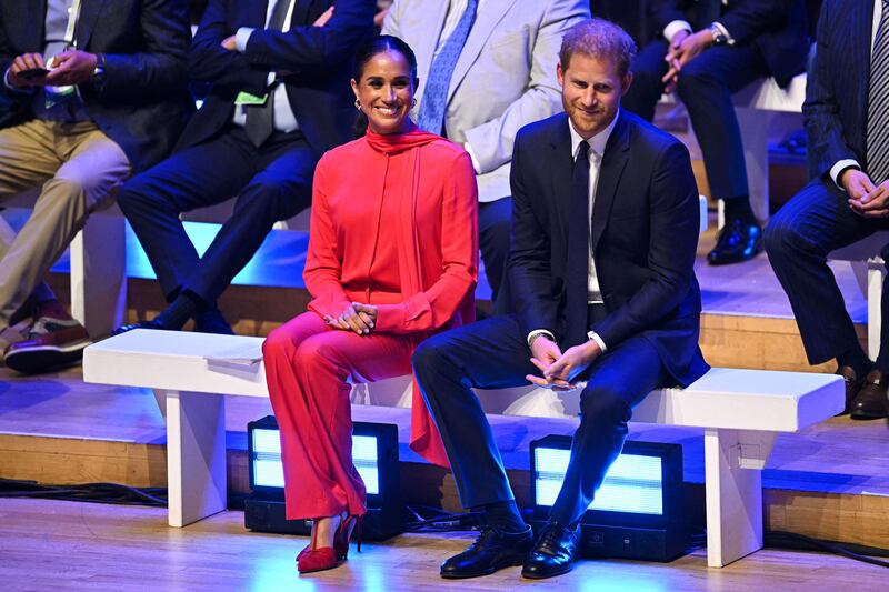 Britain's Prince Harry and his wife Meghan, the Duke and Duchess of Sussex, at the annual One Young World summit at Bridgewater Hall in Manchester, north-west England, on Monday. AFP