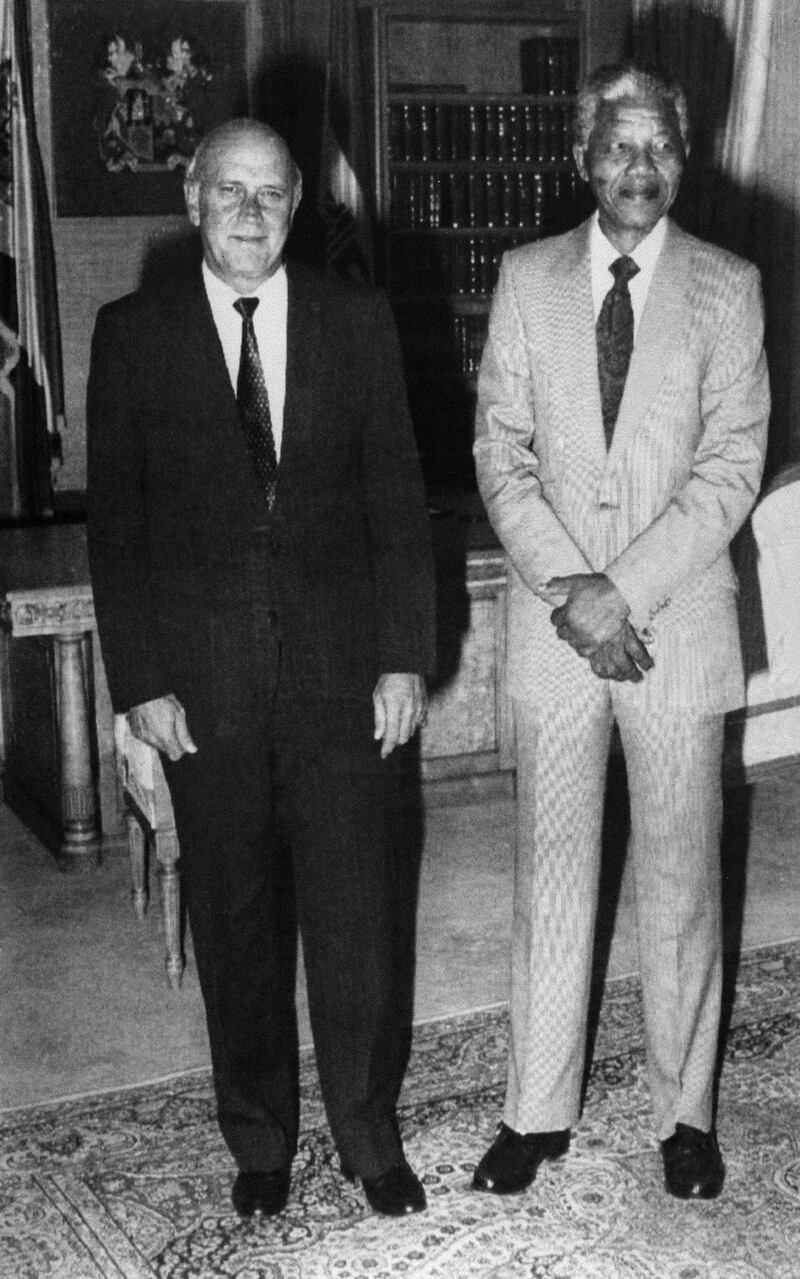 South Africa's president Frederik W. De Klerk (L) poses with the world most famous prisoner anti-apartheid leader and African National Congress (ANC) member Nelson Mandela, in Cape Town's government residence, 09 February 1990, two days before his release from jail. Frederik de Klerk announced Nelson Mandela his release from jail.