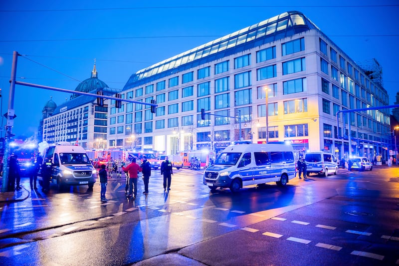 Emergency vehicles block the street in central Berlin. AP