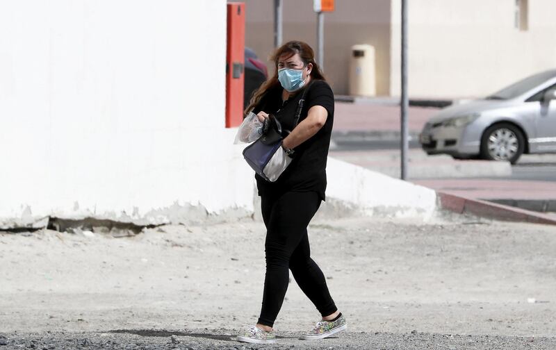 DUBAI, UNITED ARAB EMIRATES , March 19 – 2020 :- One of the commuter wearing protective face mask as a preventive measure against coronavirus near the Sharaf DG metro station in Al Barsha in Dubai. (Pawan Singh / The National) For Standalone/News/Online