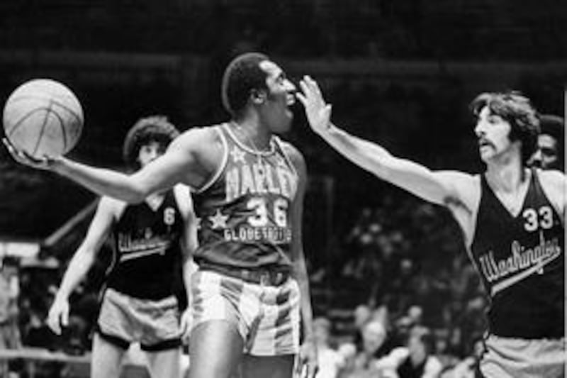 Meadowlark Lemon, left, the Harlem Globetrotters' most famous player, was always playing tricks.