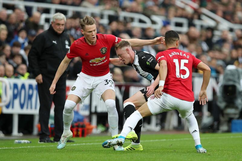 Newcastle midfielder Sean Longstaff is challenged by Scott McTominay. Getty Images