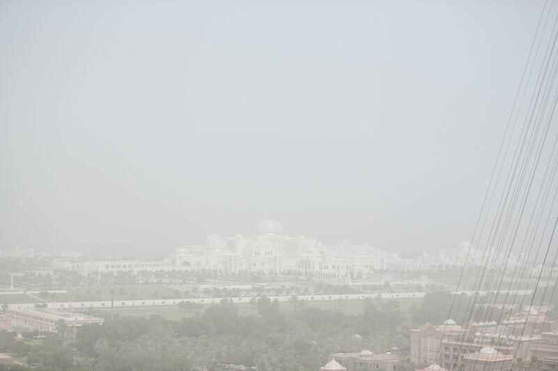 Qasr Al Watan is obscured by a haze of sand and dust in Abu Dhabi. Khushnum Bhandari / The National
