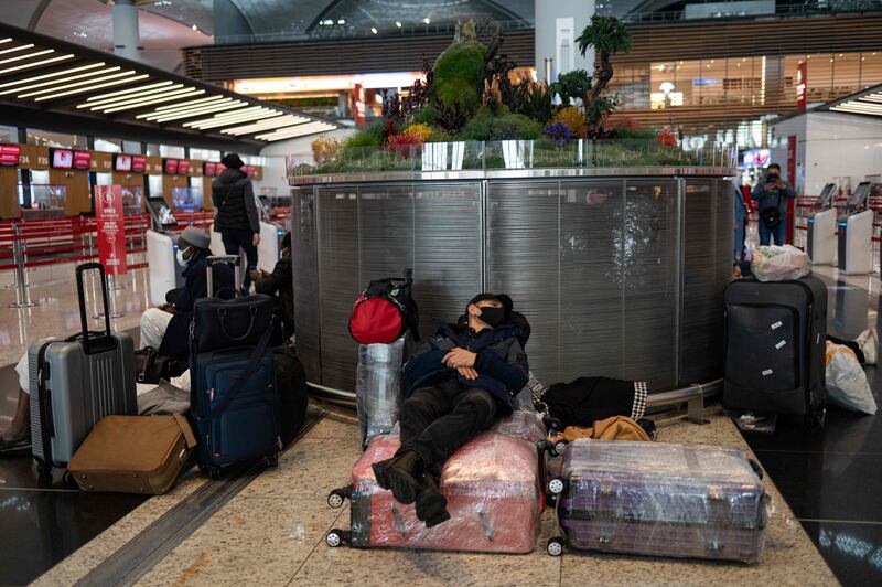 Stranded passengers wait at Istanbul Airport, where flights were cancelled due to a blizzard. AFP