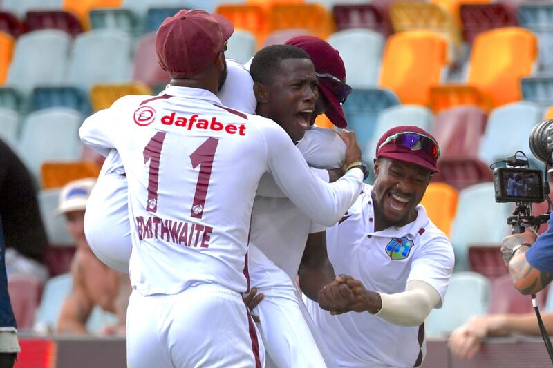 Shamar Joseph celebrates with West Indies teammates after picking up his seven wicket that secured victory. EPA
