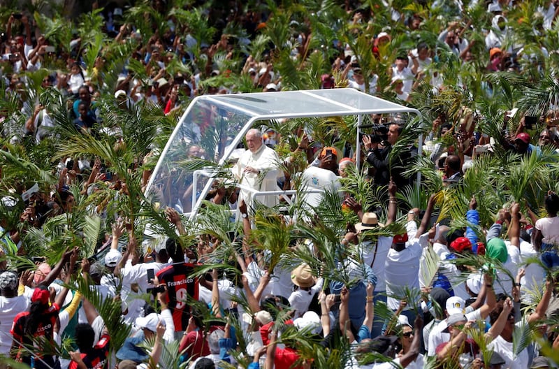 Pope Francis arrives in his Popemobile to celebrate a mass at the monument to Mary, Queen of Peace in Port Louis, Mauritius.