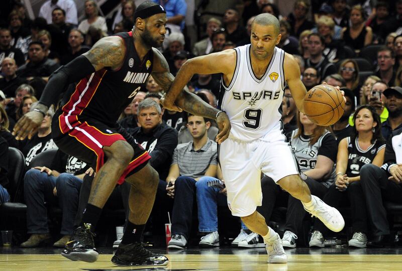 Tony Parker of the San Antonio Spurs dribbles past LeBron James of the Miami Heat during game 5 of the NBA finals on June 16, 2013 in San Antonio, Texas., where the Spurs defeated the Heat 114-104 and now lead the series 3-2. AFP PHOTO/Frederic J. BROWN
 *** Local Caption ***  359991-01-08.jpg