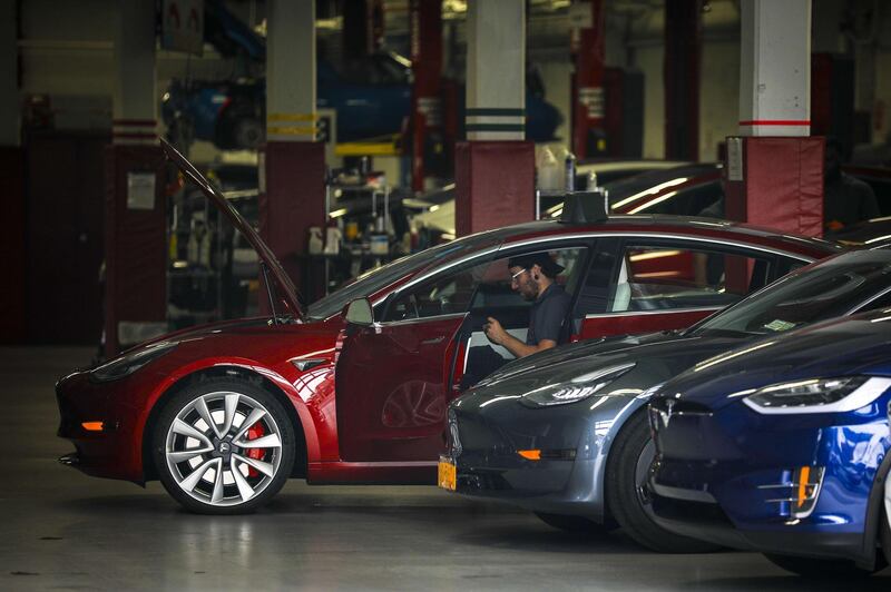 NEW YORK, NY - AUGUST 7: Tesla cars sit inside the service garage at a Tesla dealership in the Red Hook neighborhood in Brooklyn, August 7, 2018 in New York City. On Tuesday, Elon Musk told Tesla employees that he is considering taking the electric car company private, claiming that it may be the best path forward for the company. Shares of Tesla rose over 10 percent after the announcement.   Drew Angerer/Getty Images/AFP
== FOR NEWSPAPERS, INTERNET, TELCOS & TELEVISION USE ONLY ==
