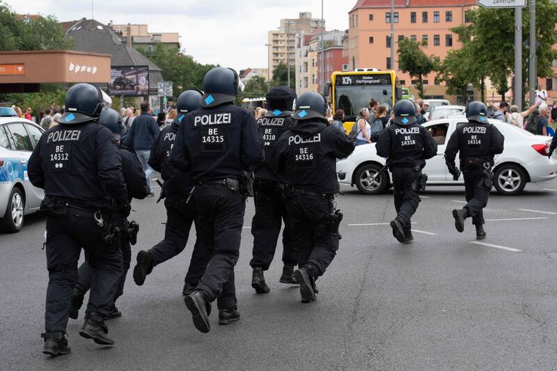 German police intervene during anti-lockdown protests in Berlin after hundreds took to the streets despite a court-ordered ban. AFP