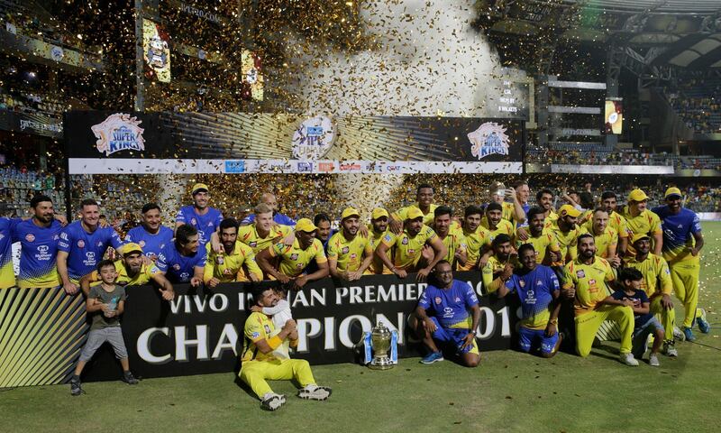 RESENDING WITH CAPTION CORRECTION, Members of Chennai Super Kings pose with trophy after wining against Sunrisers Hyderabad's at VIVO IPL cricket T20 final match in Mumbai, India, Sunday, May 27, 2018 . (AP Photo/Rafiq Maqbool)