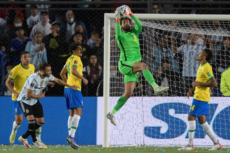 Brazil's goalkeeper Alisson catches the ball. AFP