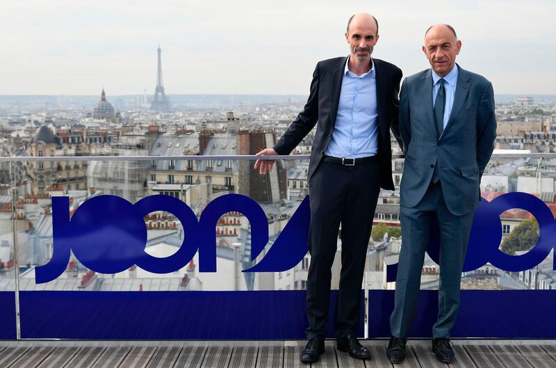 Air France-KLM's Chairman and CEO Jean-Marc Janaillac (R) poses with Joon's CEO Jean-Michel Mathieu on a roof with the EIffel tower in the background in Paris on September 25, 2017 during the launching of Joon, the new lower-cost airline subsidiary of Air France.
Joon's activities will start on December 1, 2017 with intra-Europe flights and long haul flights during summer 2018. / AFP PHOTO / Lionel BONAVENTURE