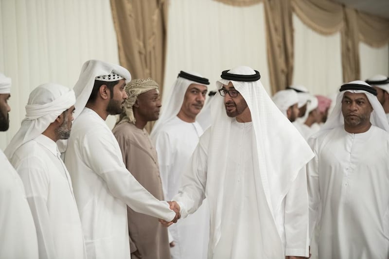 Sheikh Mohammed bin Zayed, Crown Prince of Abu Dhabi and Deputy Supreme Commander of the Armed Forces, offers condolences to the friends and family of Saeed Anbar Juma Al Falasi, who died from injuries sustained while serving the Armed Forces in Yemen. Seen with Juma Anbar Juma Al Falasi, brother of the serviceman (back R).  Ryan Carter / Crown Prince Court - Abu Dhabi