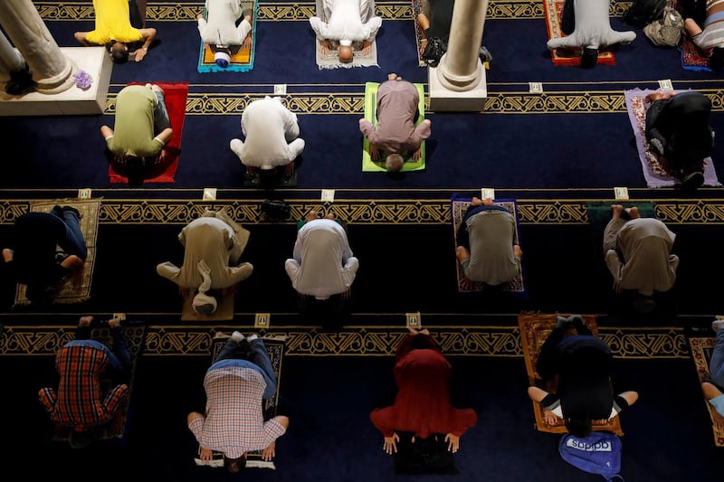 Muslims maintain social distance as they pray inside the Al-Azhar mosque during the first Friday prayers after reopening, in the old area of Cairo, Egypt. Reuters