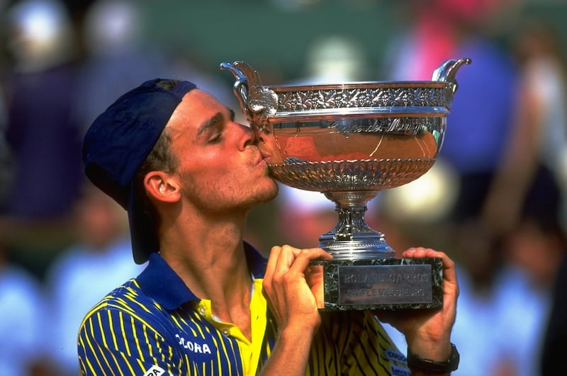 8 Jun 1997:  Gustavo Kuerten of Brazil kisses the French Open Trophy after victory against Sergi Bruguera of Spain at Roland Garros Stadium in Paris, France.  \ Mandatory Credit: Gary M Prior/Allsport