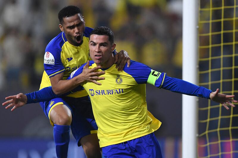 Cristiano Ronaldo celebrates after scoring Al Nassr's first goal during the Saudi Pro League match against Al Raed at Mrsool Park in Riyadh. AFP