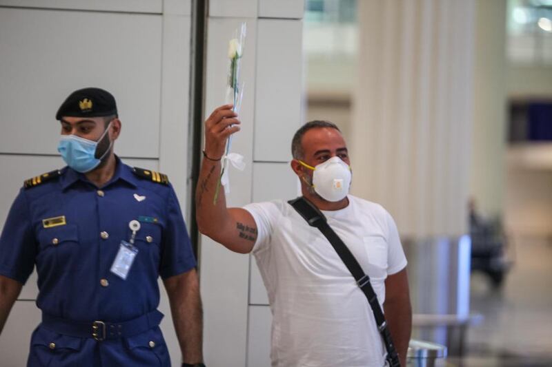 Passengers from Beirut were presented with flowers upon arrival at Dubai International Airport last night. Courtesy: Dubai Customs