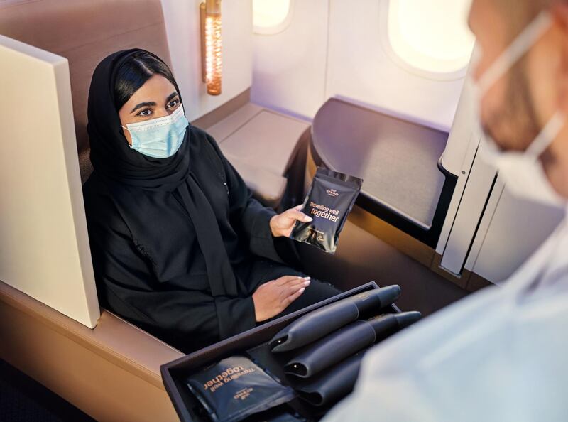 A passenger receiving an Etihad Wellness kit. Courtesy of Etihad Airways