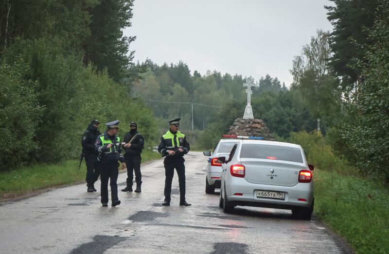 Police officers close off a road near the site of the crash in Tver region. Reuters