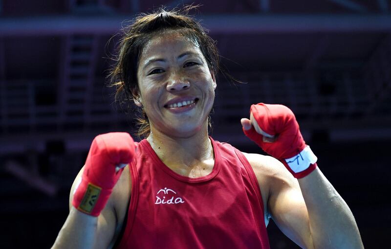 (FILES) This file photo taken on October 01, 2014, shows gold medallist India's Mary Kom reacting after being declared the winner of the women's flyweight (48-51kg) boxing final match against Kazakhstan's Shekerbekova Zhaina during the 2014 Asian Games at the Seonhak Gymnasium in Incheon.
She is a five-time world champion, mother of three and member of parliament, but Indian boxer Mary Kom believes that at 35 there is plenty more glory in the ring to come. / AFP PHOTO / INDRANIL MUKHERJEE