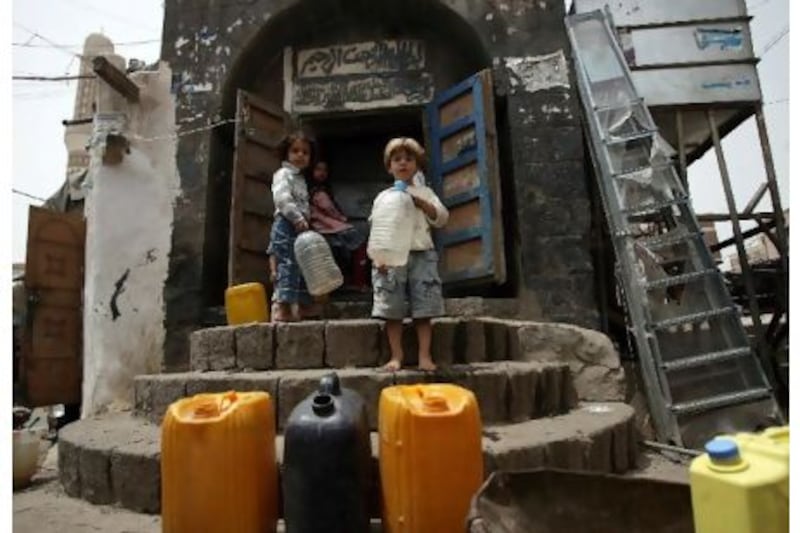 Yemeni children wait for their turn to fill water from public taps in Sanaa as the impoverished country faces water and fuel shortages amid a civil war. AFP