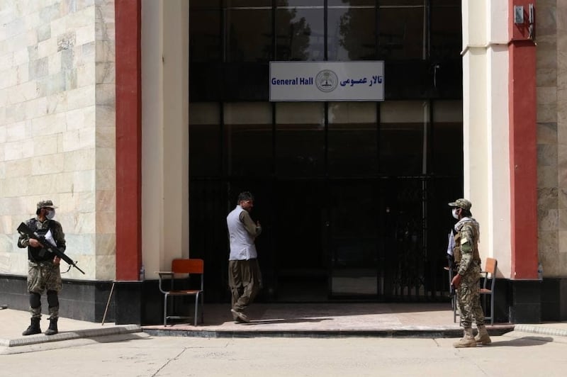 Taliban guards stand outside Kabul Education University in September. Getty