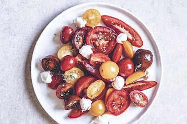 Salad with cherry tomatoes, candy tomatoes and vine tomatoes with cheese. Photo: Scott Price