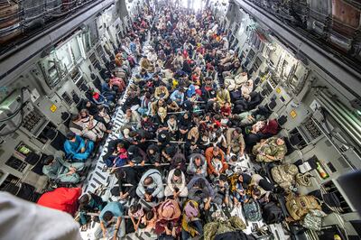 Afghan and British citizens being evacuated from Kabul on a British military aircraft. PA

