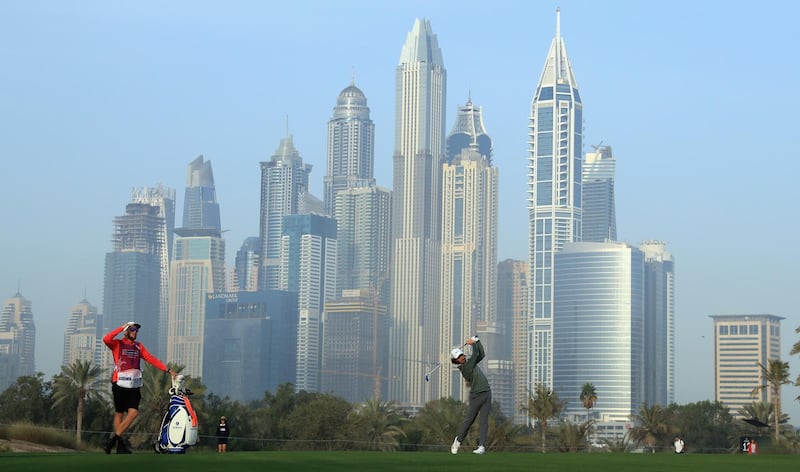 DUBAI, UNITED ARAB EMIRATES - JANUARY 27:  Tommy Fleetwood of England plays his second shot on the 13th hole during the completion of the second round of the Omega Dubai Desert Classic at Emirates Golf Club on January 27, 2018 in Dubai, United Arab Emirates.  (Photo by Andrew Redington/Getty Images)