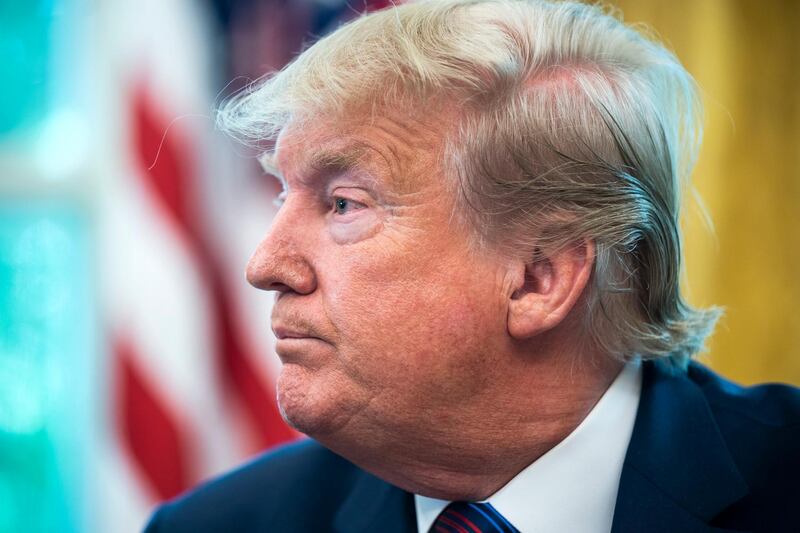 epa07742991 US President Donald J. Trump speaks to the media after reaching an asylum deal with Guatemala in the Oval Office of the White House in Washington, DC, USA, 26 July 2019. The president also spoke about Mueller's testimony before Congress, taxing French wine, and the North Korean missile launch, among other issues.  EPA/JIM LO SCALZO