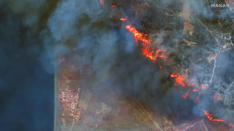 A line of flames near the village of Gennadi on the island's south-eastern coast. AP