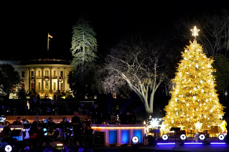 The White House is lit up after Mr Biden and his wife turn on the National Christmas Tree. AP