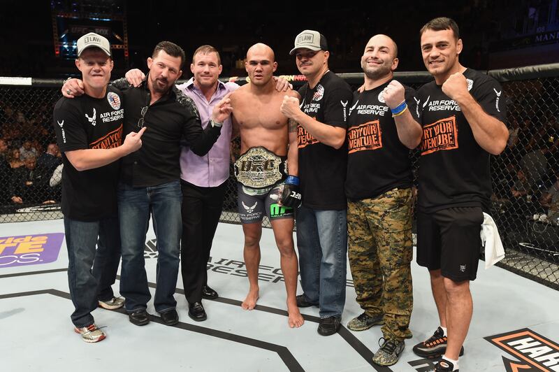 Robbie Lawler poses with his teammates after defeating Johny Hendricks in their UFC welterweight championship bout during UFC 181 inside the Mandalay Bay Events Center on December 6, 2014 in Las Vegas, Nevada. Getty Images