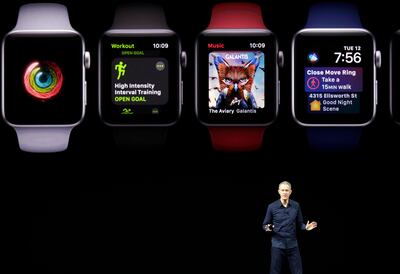 Jeff Williams, Apple's chief operating officer, shows new Apple Watch products at the Steve Jobs Theater on the new Apple campus on Tuesday, Sept. 12, 2017, in Cupertino, Calif. (AP Photo/Marcio Jose Sanchez)