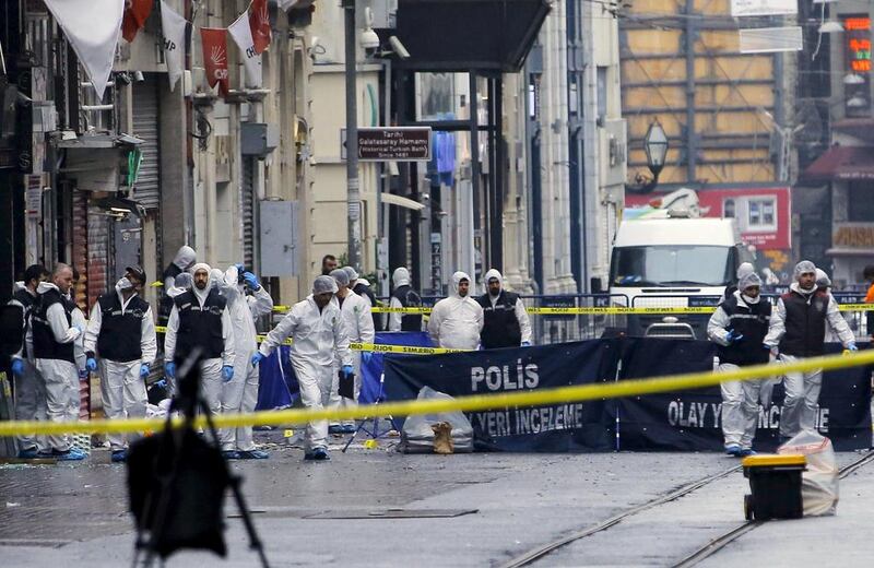 Police forensic experts inspect the area after a suicide bombing in a major shopping and tourist district in central Istanbul, Turkey (REUTERS/Huseyin Aldemir)