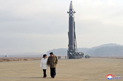 North Korean leader Kim Jong-un, with a girl purported to be his daughter, at an intercontinental ballistic missile site. Reuters