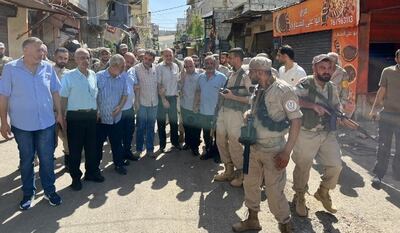The joint Palestinian security force, led by Maj Gen Mahmoud Al Ajouri, deployed inside UNRWA schools after the withdrawal of militants on Friday. Photo: Lebanon National News Agency