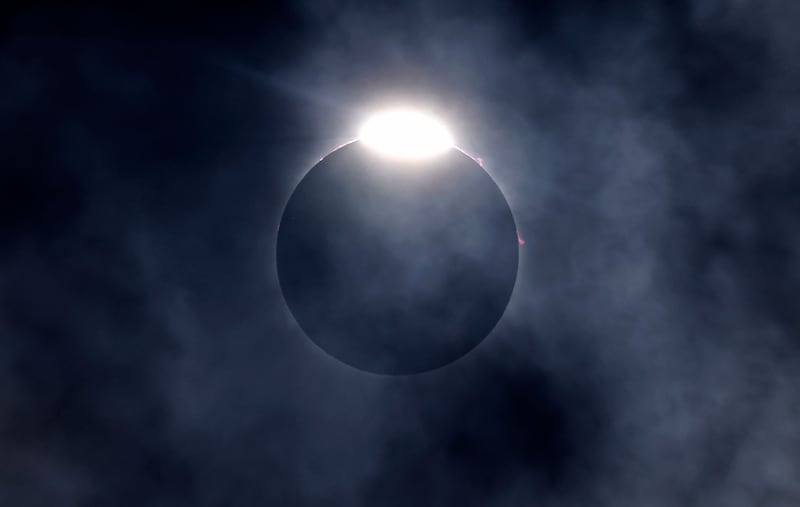 The diamond ring effect as well as Bailey's Beads are seen as the Moon eclipses the Sun in Fort Worth, Texas. Getty Images / AFP 