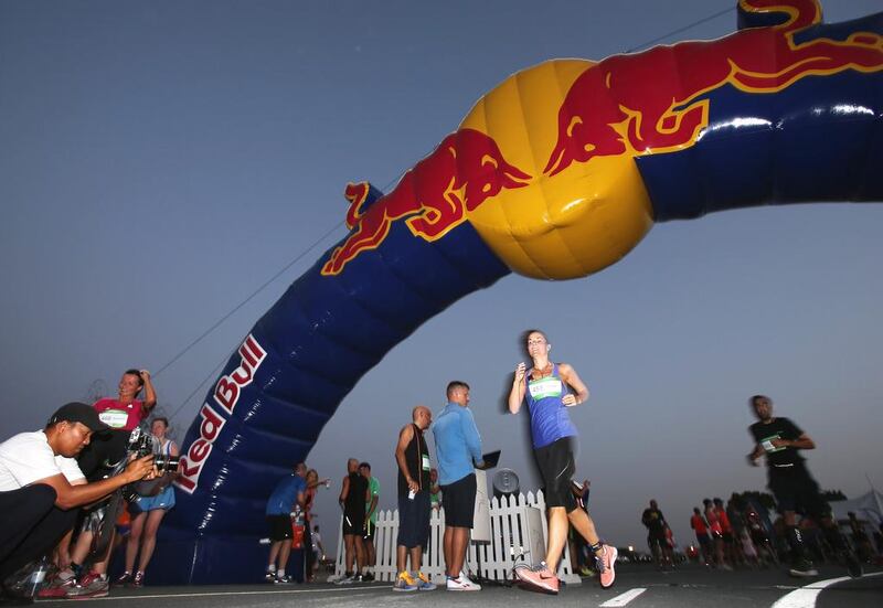 Runners return to the finish of the 10-kilometre Wings for Life World Run at Nad Al Sheba Cycle Park on Sunday in Dubai. Francois Nel / Getty Images / May 4, 2014