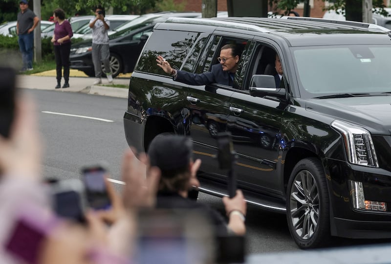 Depp waves to his fans. Reuters